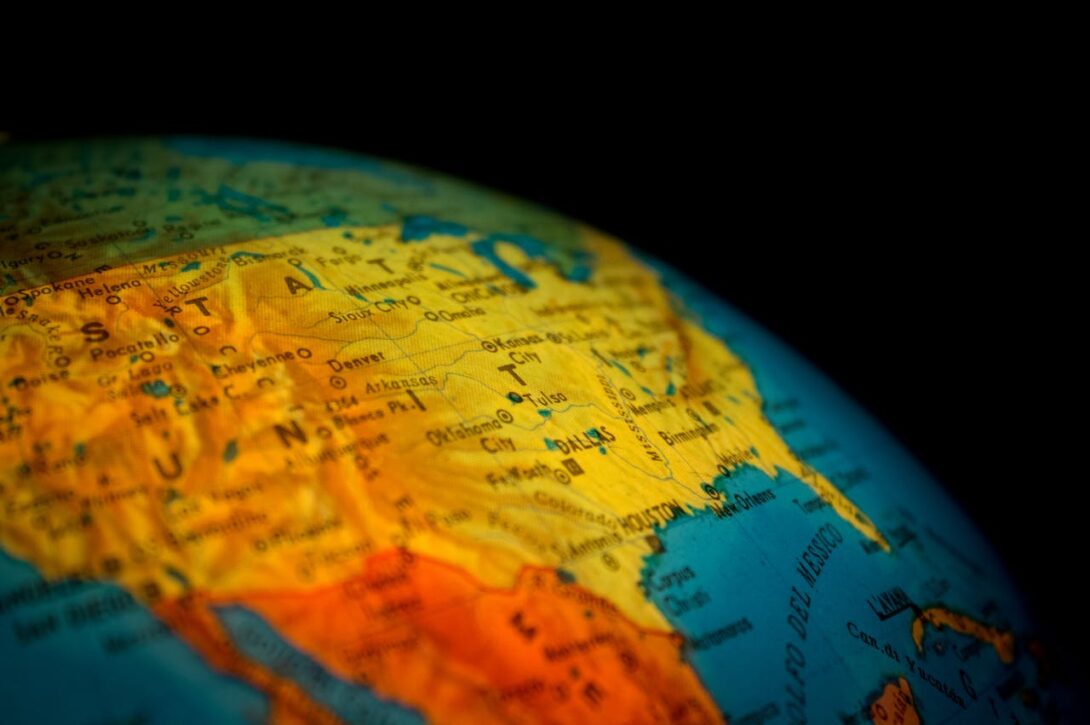 What explains the worldwide patterns in user-generated geographical content?